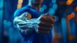 © Earny - Close-up of a strong male hand making a fist, symbolizing strength and determination in a dynamic gym environment.