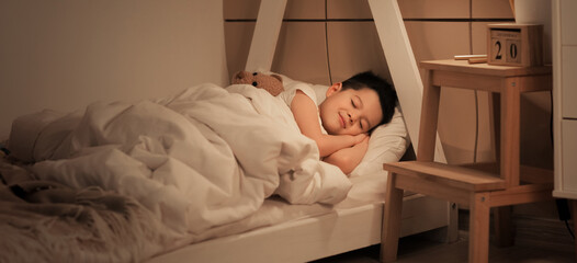 Sticker - Cute little Asian boy sleeping in bed