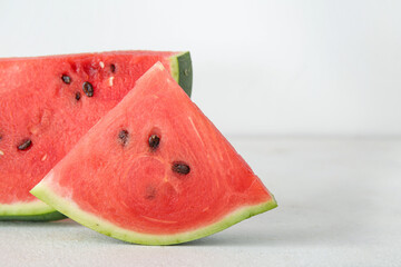 Pieces of ripe watermelon on light background, closeup