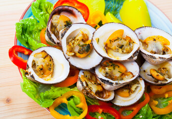 Wall Mural - Baked in oven European bittersweet clams served with boiled potatoes, fresh vegetables and greens