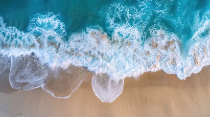 Aerial View of Waves Crashing on a Sandy Beach