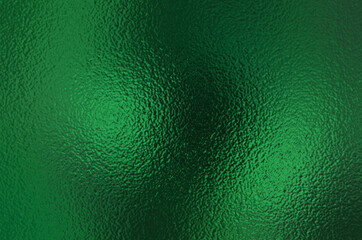 Wall Mural - Dark green foil glass texture background. Abstract gradient bright light reflection and shiny rough texture surface. Glass effect background 