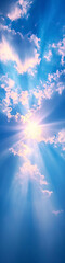 Wall Mural - a beautiful blue sky with sun rays illuminating the clouds from behind.