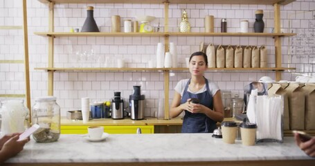 Canvas Print - Coffee shop, smile and waitress helping customer with takeaway cappuccino, latte or caffeine. Happy, cafe and young female barista from Canada with woman for warm beverage in a modern restaurant.