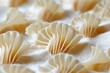 © Outkast - Close-up of White, Fan-Shaped Pasta in Flour