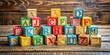 © Arnada - Colorful wooden alphabet blocks with bold, serif, and cursive fonts on a rustic wooden background, forming a whimsical and educational visual treat.