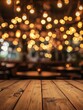 © nelzajamal - Image of wooden table in front of abstract blurred restaurant lights background - ai
