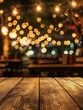 © nelzajamal - Image of wooden table in front of abstract blurred restaurant lights background - ai