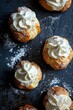 © AURA COLLECTIONS - Close-up of Cream Puffs with Powdered Sugar on Black Background.