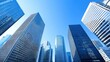 © BOJOShop - Modern Glass Skyscrapers Upward View Blue Sky Urban Architecture