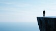 © Intelligent Horizons - Lone figure standing on the precipice of a dramatic cliff gazing into the vast open abyss below evoking a sense of fear vertigo and existential contemplation