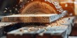 © TheWaterMeloonProjec - Close-up view of a saw slicing through a timber beam during board installation in a woodworking shop, featuring excellent image quality.