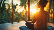 © Wararat - An individual practicing mindfulness meditation in a quiet, sunlit room with a comfortable cushion