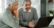 © PeakPoints/peopleimages.com - Senior couple, laptop and finance with budget for retirement or pension fund at home. Mature, elderly man and woman with computer for utility bills, mortgage expenses or online payment at house