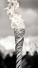 Sticker - A close-up of a burning torch with a blurred background.