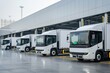 © Larisa - Fleet of modern trucks parked in row at warehouse