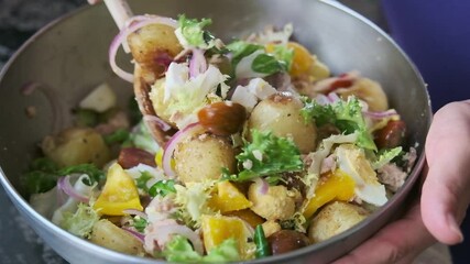 Wall Mural - Cooking a summer salad with potatoes and tuna