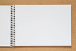© romantiche - ketch book with spiral bound laying on wooden desk