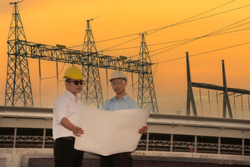 Two men engineer look at blueprint architecture building contractor design in modern city development. Males engineer holding project planing partner teamwork. Man meeting together construction site