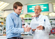 © StarDweller/peopleimages.com - Pharmacy, medicine and prescription with people in store for pills, advice and healthcare. Medical, insurance and antibiotic consulting with pharmacist in clinic for help, drugstore and dispensary