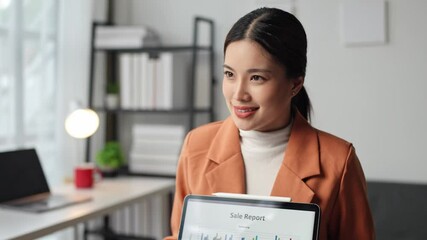 Wall Mural - Businesswoman presenting work at a conference By analyzing financial data using tablets and various graphs and charts. Technology in the modern office startup business idea.