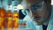 © Rere_Art151 - Close-up of a Scientist in a Lab with Glass Bottles