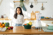 © Art_Photo - Asian girl in modern kitchen with fresh vegetables and fruit, healthy cooking, child learning about nutrition, young chef, homemade meal preparation kitchen activity, healthy lifestyle, food education