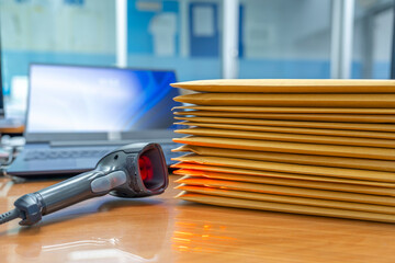 Wall Mural - Stacks of Brown envelope, piles of unfinished documents, Business report papers, Using scanner machine for convert document to digital data storing into computer.