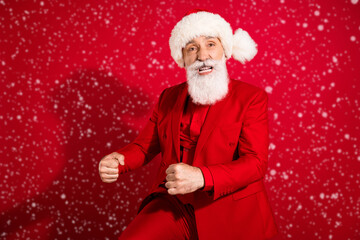 Wall Mural - Photo of harsh crazy santa claus dance corporate party entertaining quests wear x-mas hat suit on red color background