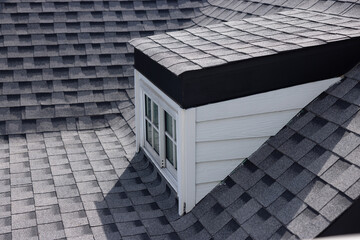 Sticker - A roof with a garret window and roof shingle.