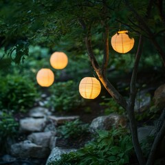 Poster - Four paper lanterns hang from a tree branch, illuminating a garden path at dusk.