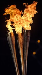 Sticker - Four torches with flames burning against a dark background.