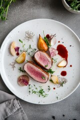 Meticulously arranged sous-vide duck breast with pear compote on a white plate, showcasing modern culinary artistry and vibrant design