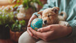 © Mahnoor - cute puppy hugging around world globe modal in human hands , pet dog , world pet day