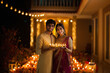© PRASANNAPIX - young indian couple holding oil lamp in the plate