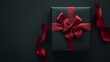 © Oleg - Elegant black gift box with red ribbon on dark background, ideal for black friday promotions
