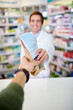 © StarDweller/peopleimages.com - Hands, pharmacist and bag for prescription drugs at dispensary, customer and shop for treatment. Person, antibiotics and pov for over the counter medication at apothecary, tablets and medicine parcel