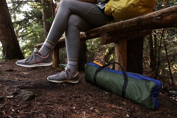 Poster - Young hiker wearing sneakers in forest, closeup