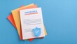 © Nim9ty  Pics - Creative flat lay of insurance document with colorful papers, emphasizing security and trust in financial planning.