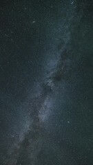 Wall Mural - vertical background of milky way galaxy stars astronomy time lapse