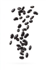 Black beans floating on white background