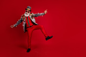 Sticker - Photo of optimistic positive man wear stylish suit jacket celebrate xmas have fun isolated on red color background