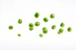 © EdvvinStudios - Green peas falling on white background