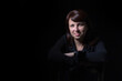 © Mariakray - Young caucasian woman portrait on black background in studio