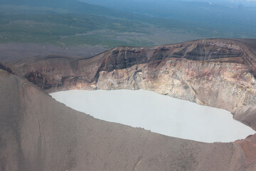 Sticker - Russia Kamchatka acid lake in Maly Semyachik volcano on a summer cloudy day