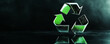 © wolfhound911 - A modern background with a sleek, metallic recycling symbol in green and silver, set against a high-gloss, dark surface with reflective accents.