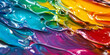 © wolfhound911 - Liquid paints in vibrant rainbow colors, swirling together with a glossy, reflective surface that creates a dynamic and playful effect.