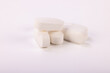 © Shutterly - High-detail image of white pills on a neutral white background, perfect for illustrating medical treatments