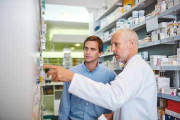 Wall Mural - Pharmacy, advice and consulting with people in store for medicine, pills and healthcare. Medical, insurance and antibiotic prescription with pharmacist in clinic for help, drugstore and dispensary