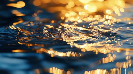 Wall Mural - Close-up of shimmering water reflecting golden light, creating a tranquil atmosphere.